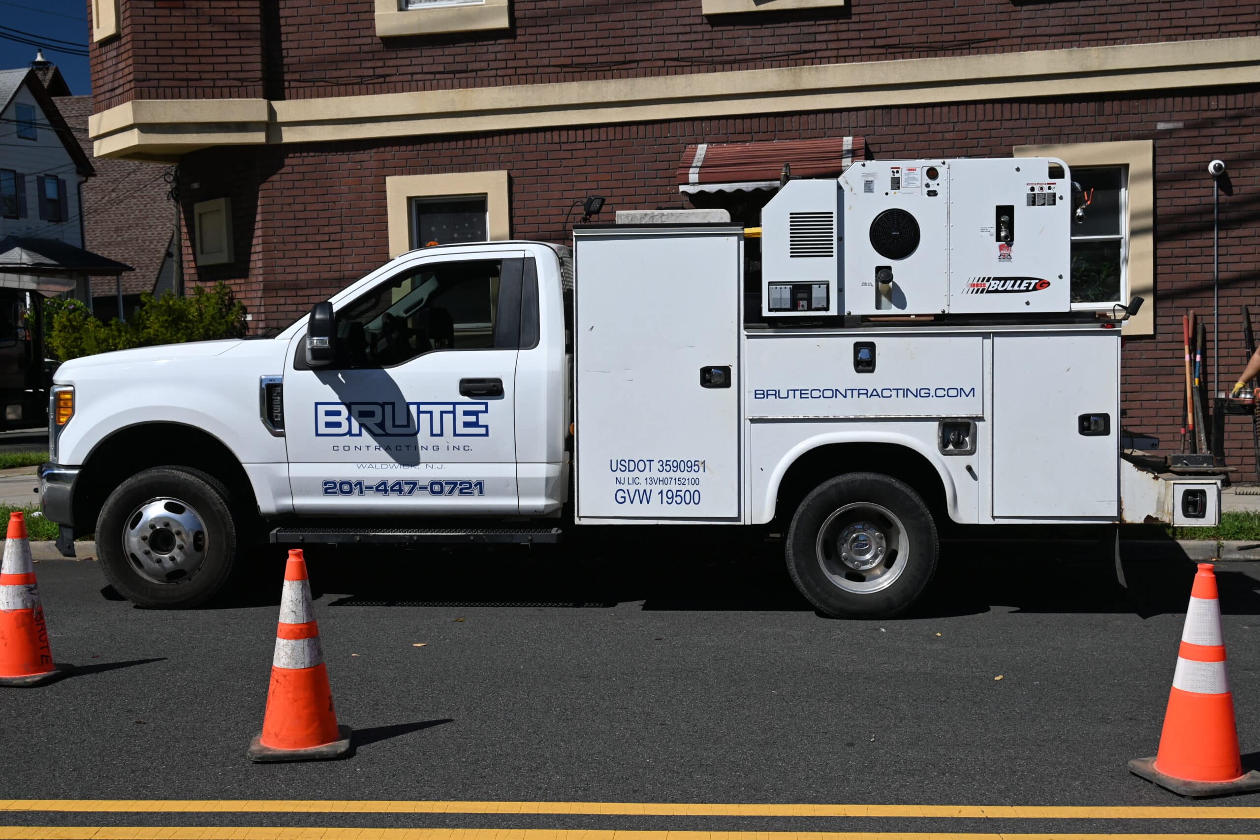 BRUTE Contracting truck in front of a residential apartment building