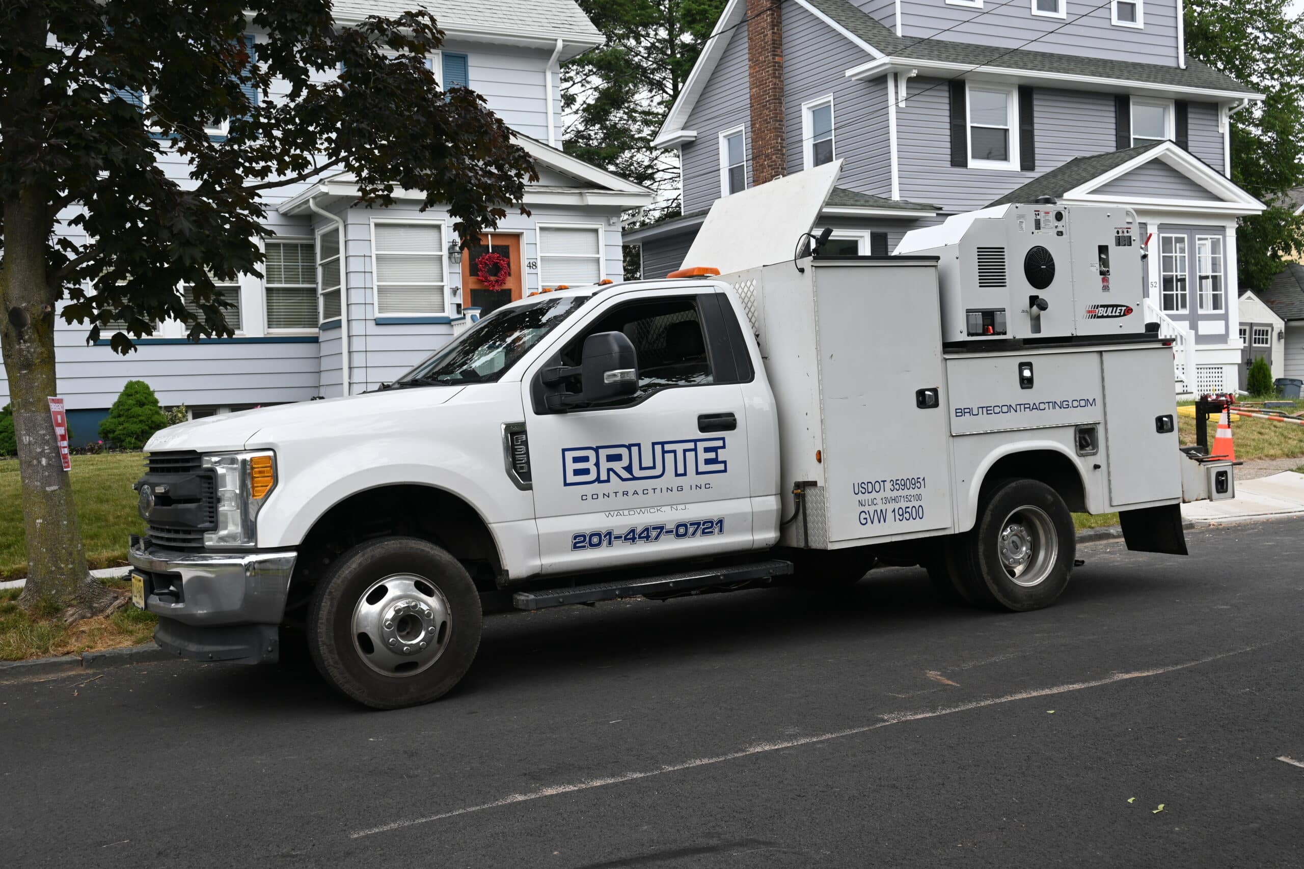 BRUTE Contracting sewer and water utility truck parked on the street during a trenchless sewer repair service in New Jersey